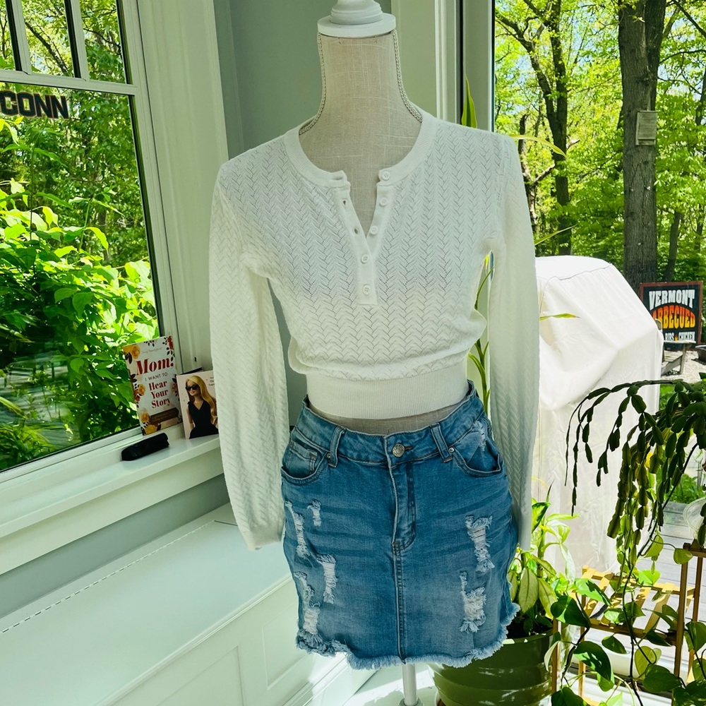 Pretty pointelle sweater and distressed denim mini skirt